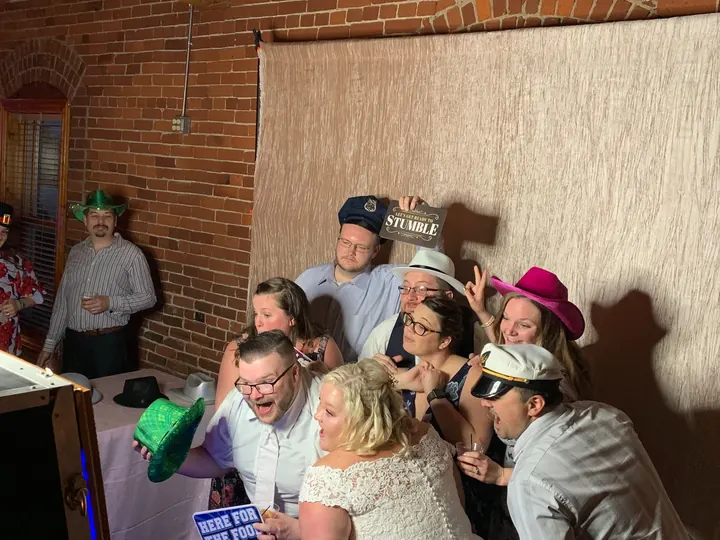 Wedding guests having fun together at a photo booth