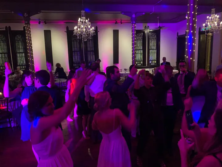 Wedding dance floor illuminated with purple lighting
